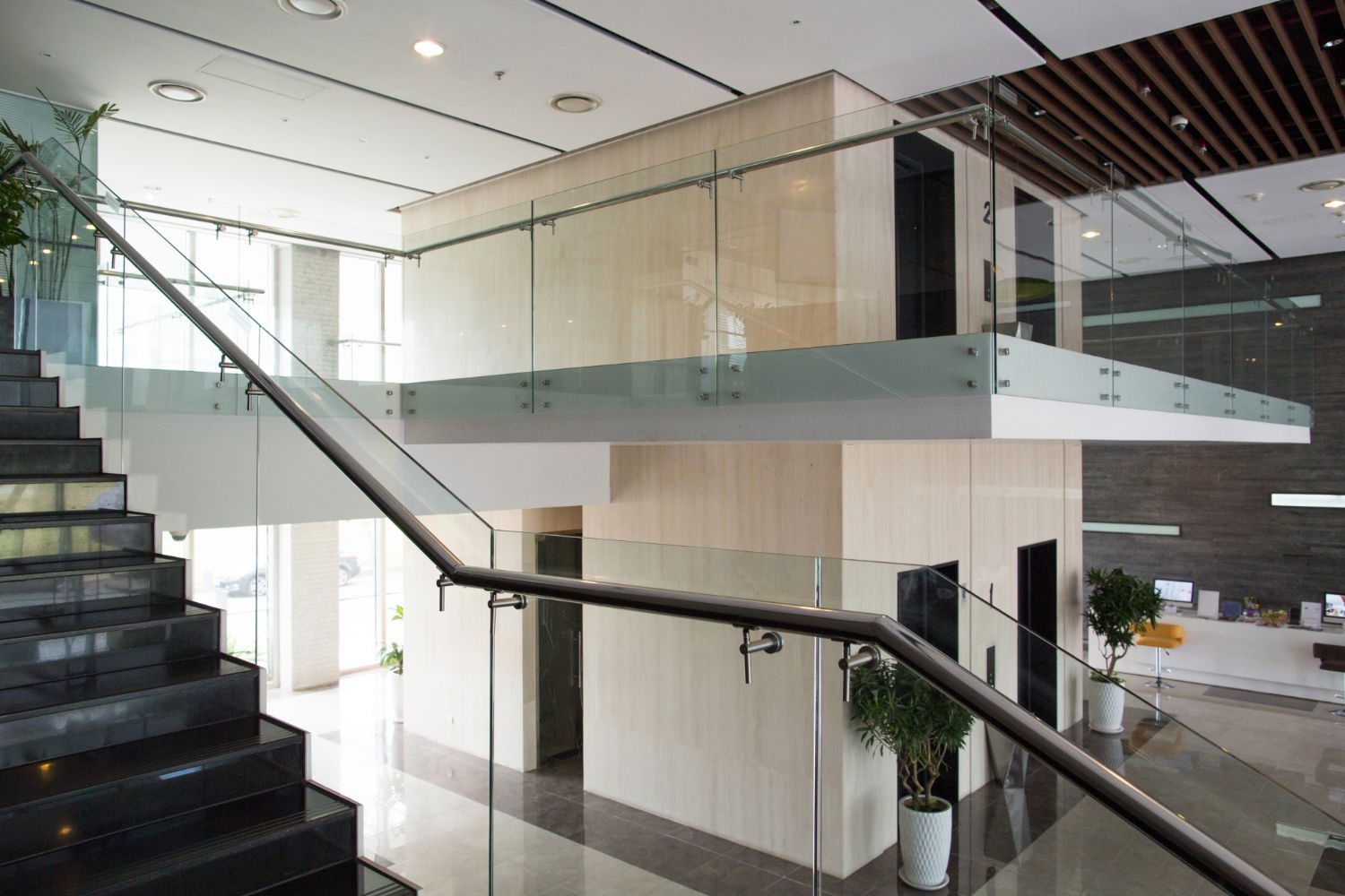 Glass stair railings in an office building.