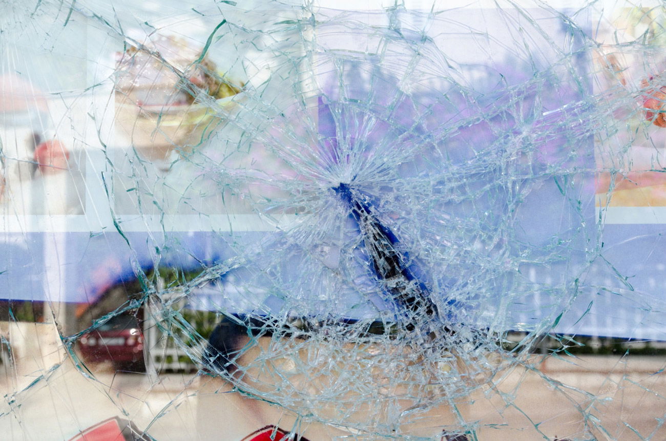 A shattered glass in a store window.